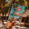 A hand holding a guide to Tours in Zanzibar